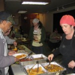 Gore Wired owner Colleen Davis serves a free breakfast to the homeless